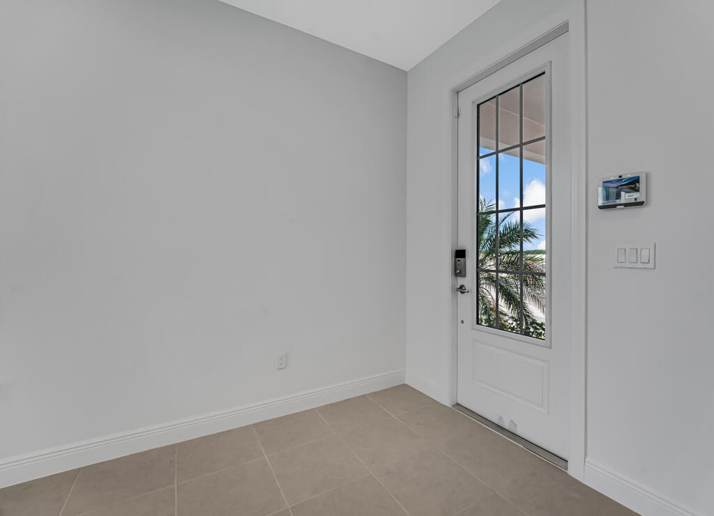 930 Southwest Pr Avenue Palm City, FL 34990 - Photo 5 of 66 an empty room with windows and closet