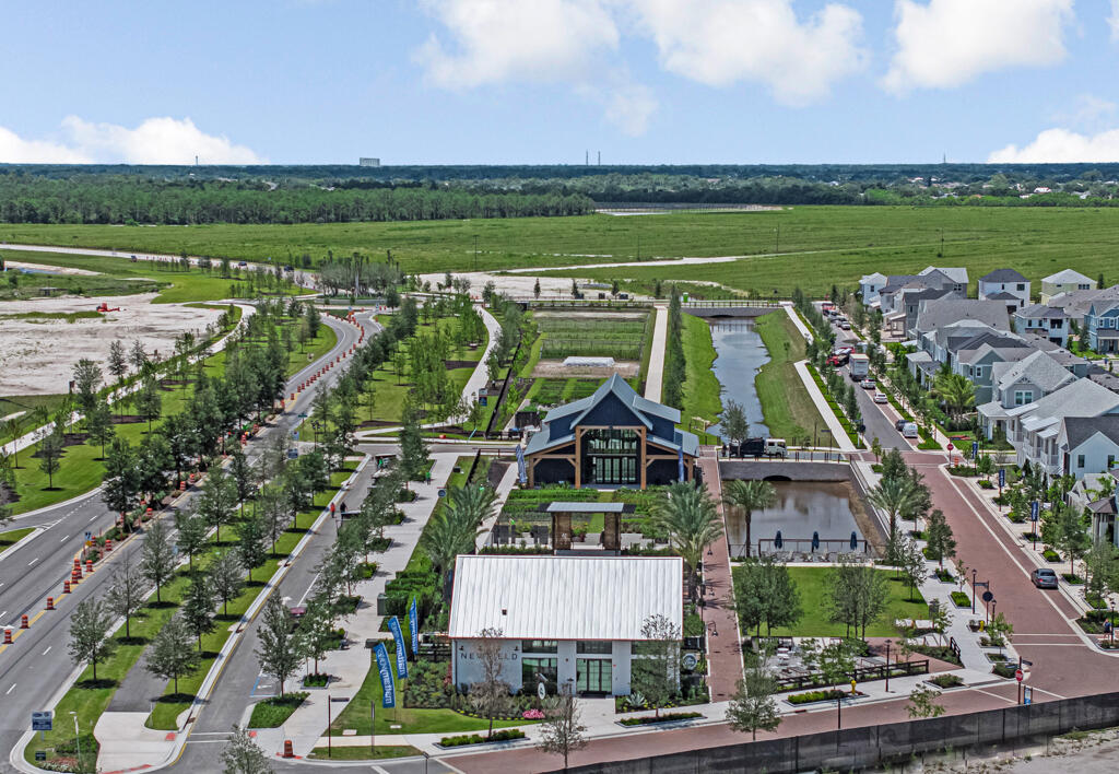 930 Southwest Pr Avenue Palm City, FL 34990 - Photo 58 of 66 an aerial view of a city with lots of residential buildings ocean and mountain view in back