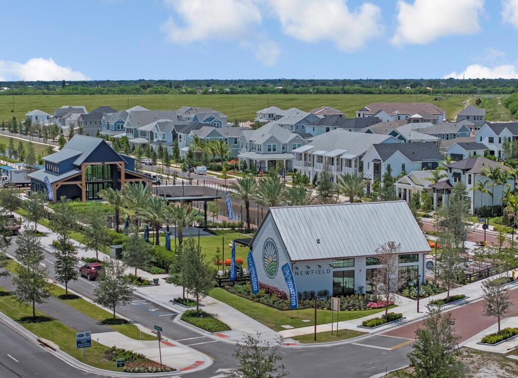 930 Southwest Pr Avenue Palm City, FL 34990 - Photo 64 of 66 a view of a city with lawn chairs and large trees