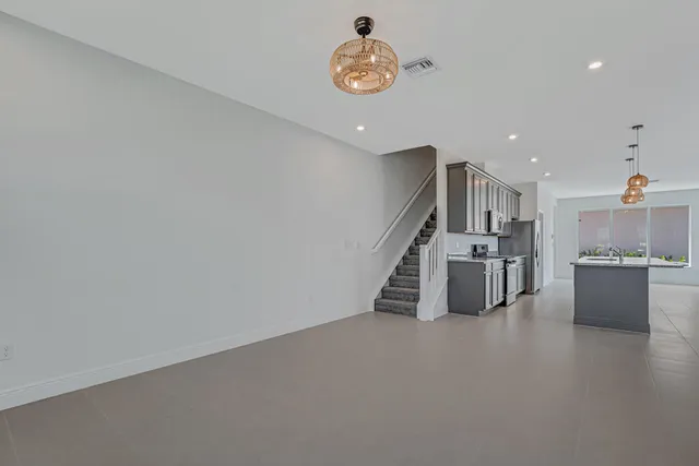 a large kitchen with a large window and counter top