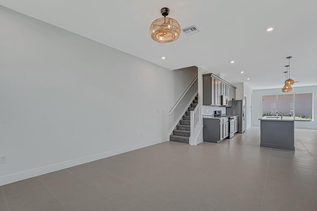 930 Southwest Pr Avenue Palm City, FL 34990 - Photo 7 of 66 a view of a kitchen with furniture and a kitchen view