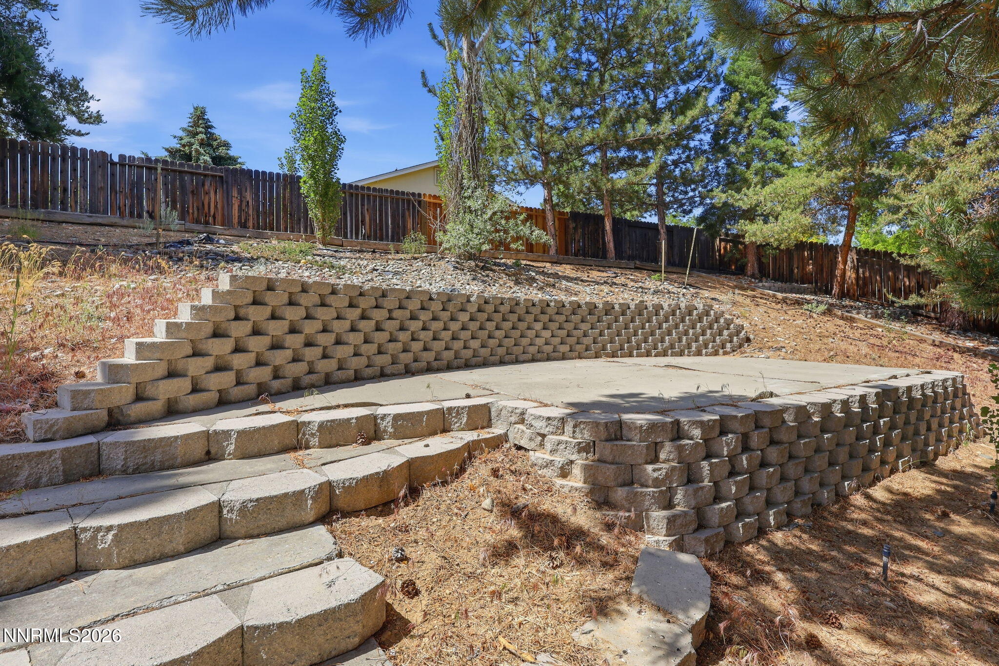 6840 Viscaya Court Reno, NV 89523 - Photo 7 of 25 a view of a backyard with wooden fence