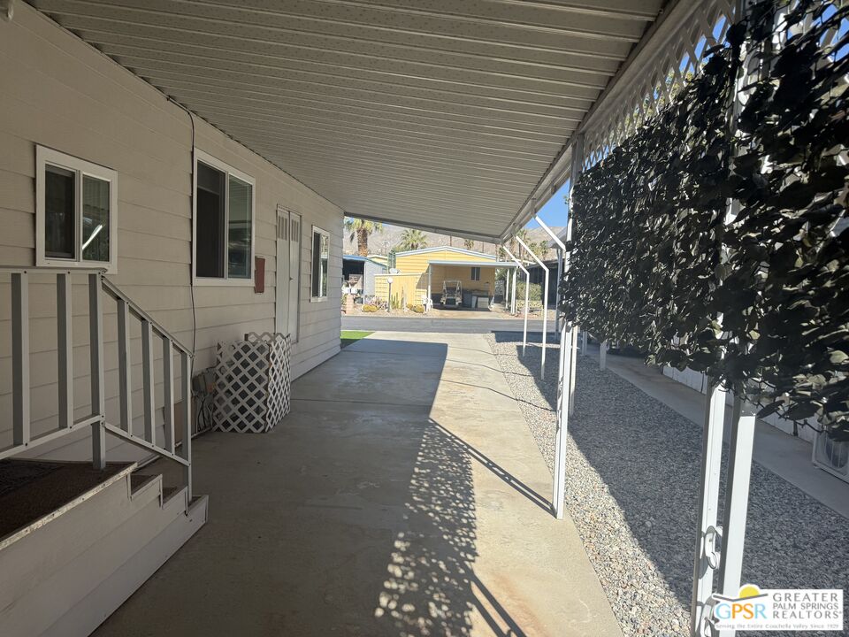 15500 Bubbling Wells Road, Unit 286 Desert Hot Springs, CA 92240 - Photo 24 of 50 a porch with seating space