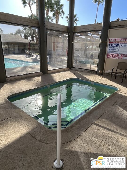 15500 Bubbling Wells Road, Unit 286 Desert Hot Springs, CA 92240 - Photo 34 of 50 a view of a glass door with a yard