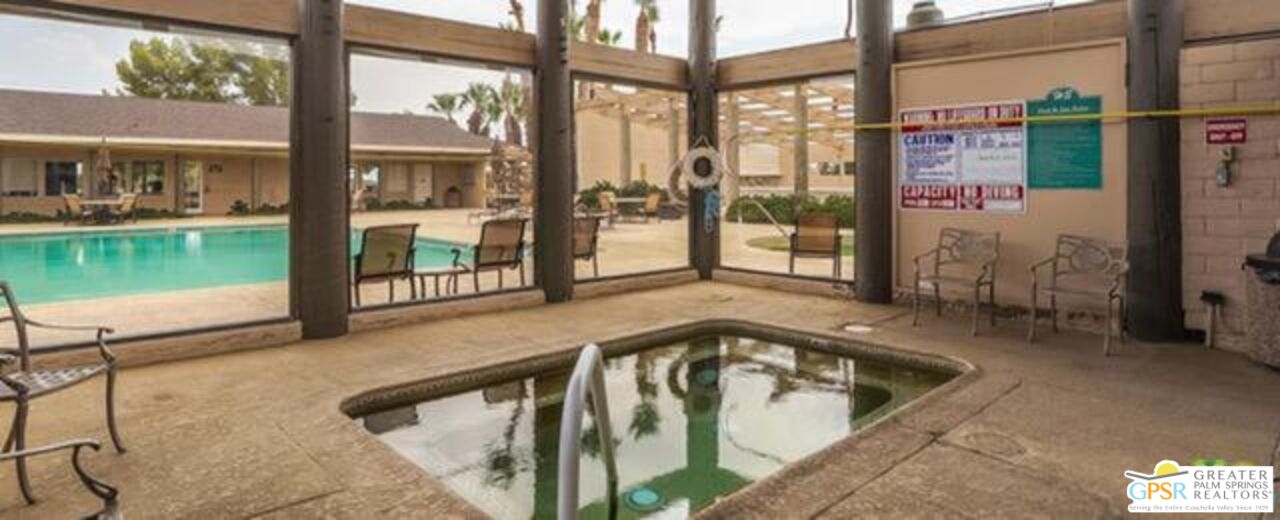 15500 Bubbling Wells Road, Unit 286 Desert Hot Springs, CA 92240 - Photo 35 of 50 a swimming pool with outdoor seating