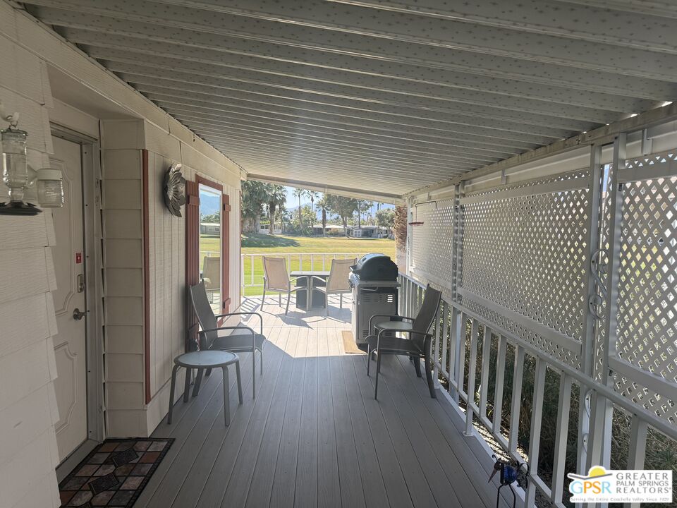15500 Bubbling Wells Road, Unit 286 Desert Hot Springs, CA 92240 - Photo 6 of 50 a view of a patio with table and chairs