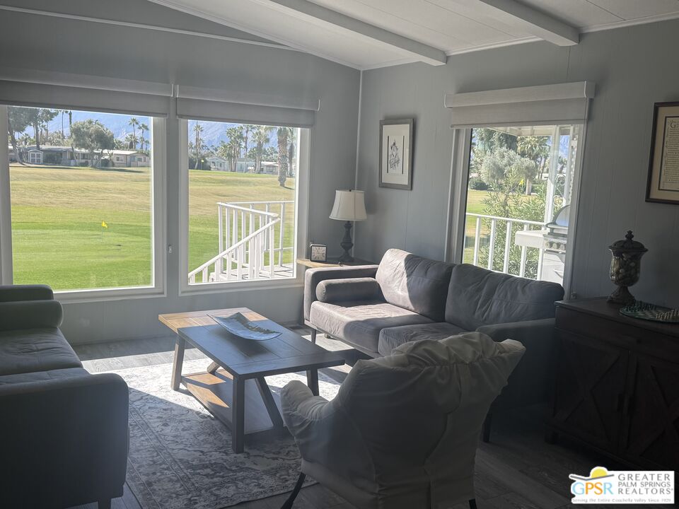 15500 Bubbling Wells Road, Unit 286 Desert Hot Springs, CA 92240 - Photo 8 of 50 a living room with furniture and a window