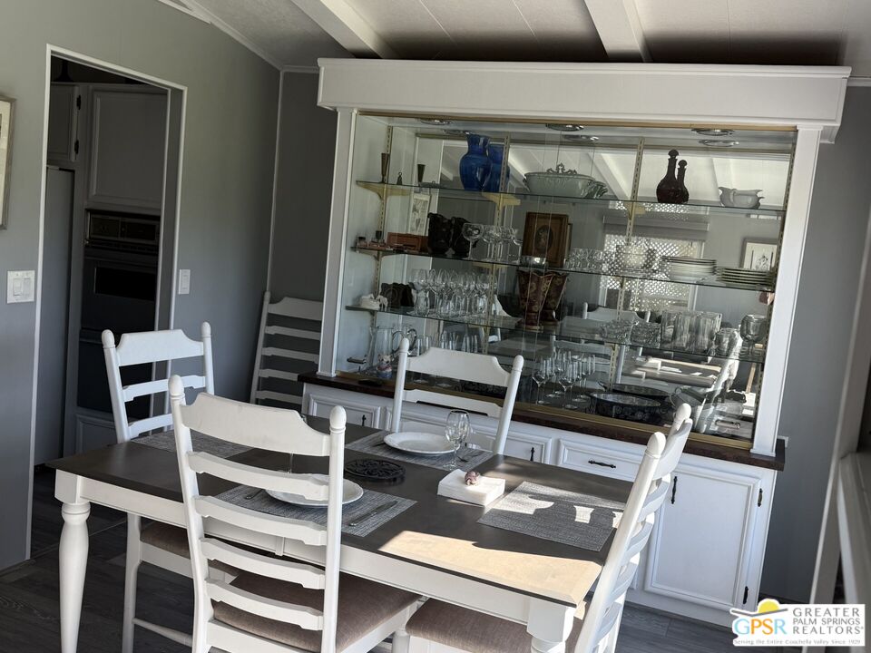 15500 Bubbling Wells Road, Unit 286 Desert Hot Springs, CA 92240 - Photo 9 of 50 a view of dining room with wooden floor