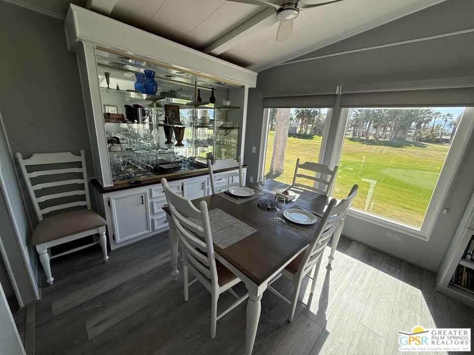 15500 Bubbling Wells Road, Unit 286 Desert Hot Springs, CA 92240 - Photo 10 of 50 a view of a dining room with furniture window and outside view