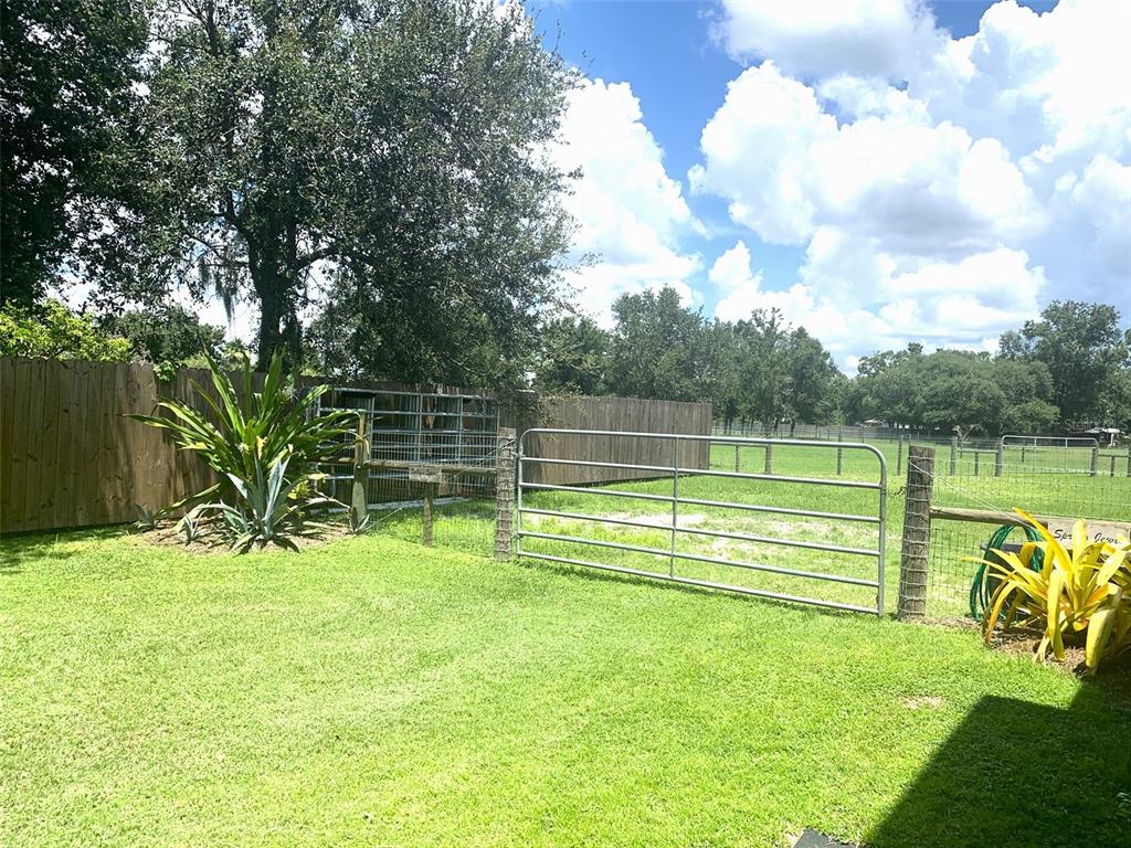 1470 Nestor Court North Port, FL 34286 - Photo 12 of 13 a view of a park with large trees