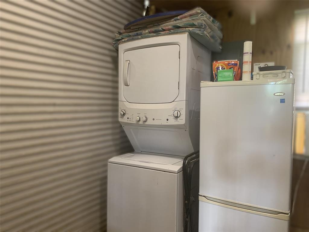 1470 Nestor Court North Port, FL 34286 - Photo 8 of 13 a utility room with dryer and washer