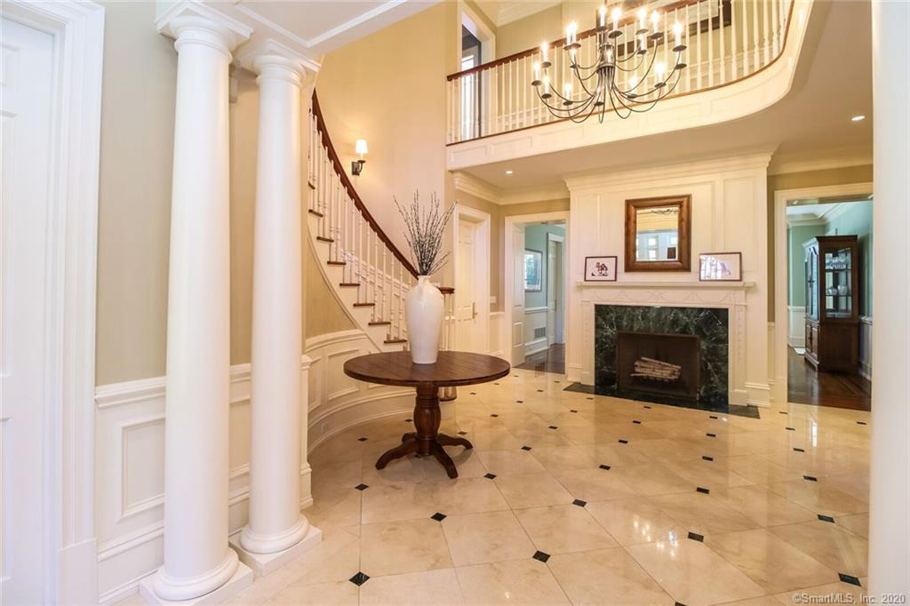 83 Lukes Wood Road New Canaan, CT 06840 - Photo 2 of 51 a view of a livingroom with furniture and a fireplace
