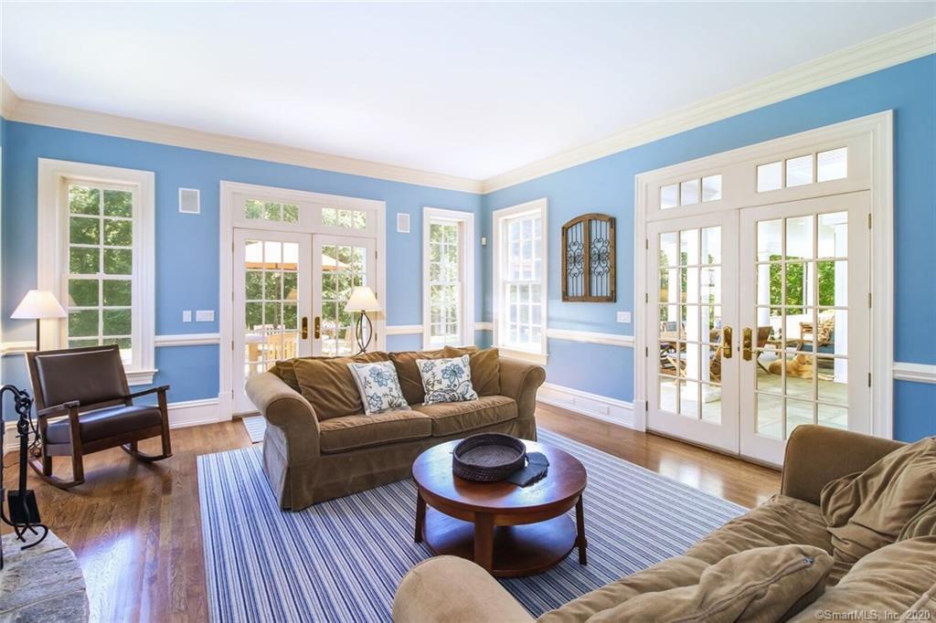 83 Lukes Wood Road New Canaan, CT 06840 - Photo 12 of 51 a living room with furniture and a large window