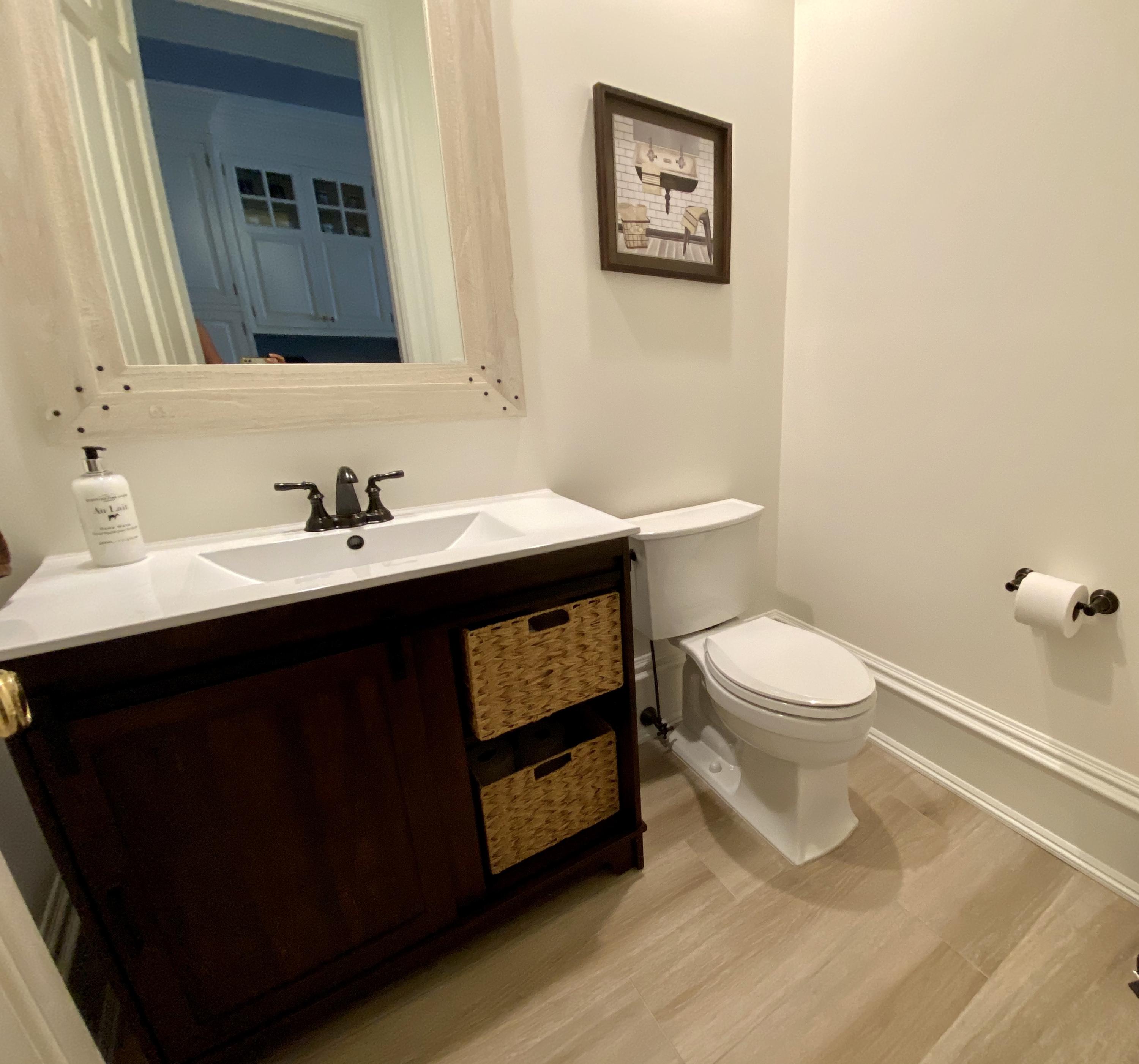 83 Lukes Wood Road New Canaan, CT 06840 - Photo 14 of 51 a bathroom with a sink toilet and mirror