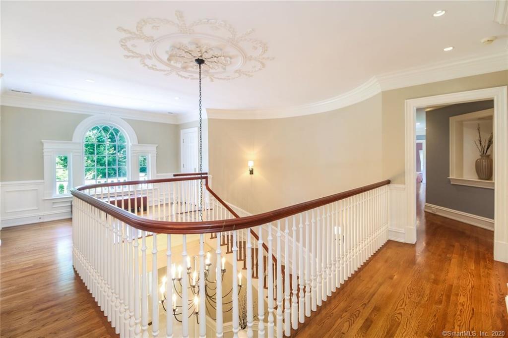 83 Lukes Wood Road New Canaan, CT 06840 - Photo 15 of 51 a view of entryway and hall with wooden floor