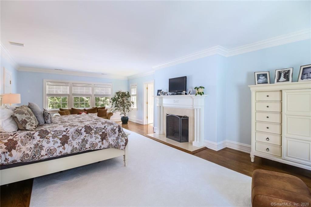 83 Lukes Wood Road New Canaan, CT 06840 - Photo 16 of 51 a living room with furniture and a fireplace