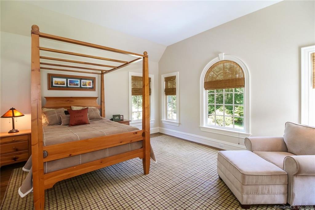 83 Lukes Wood Road New Canaan, CT 06840 - Photo 20 of 51 a bedroom with a bed and a window
