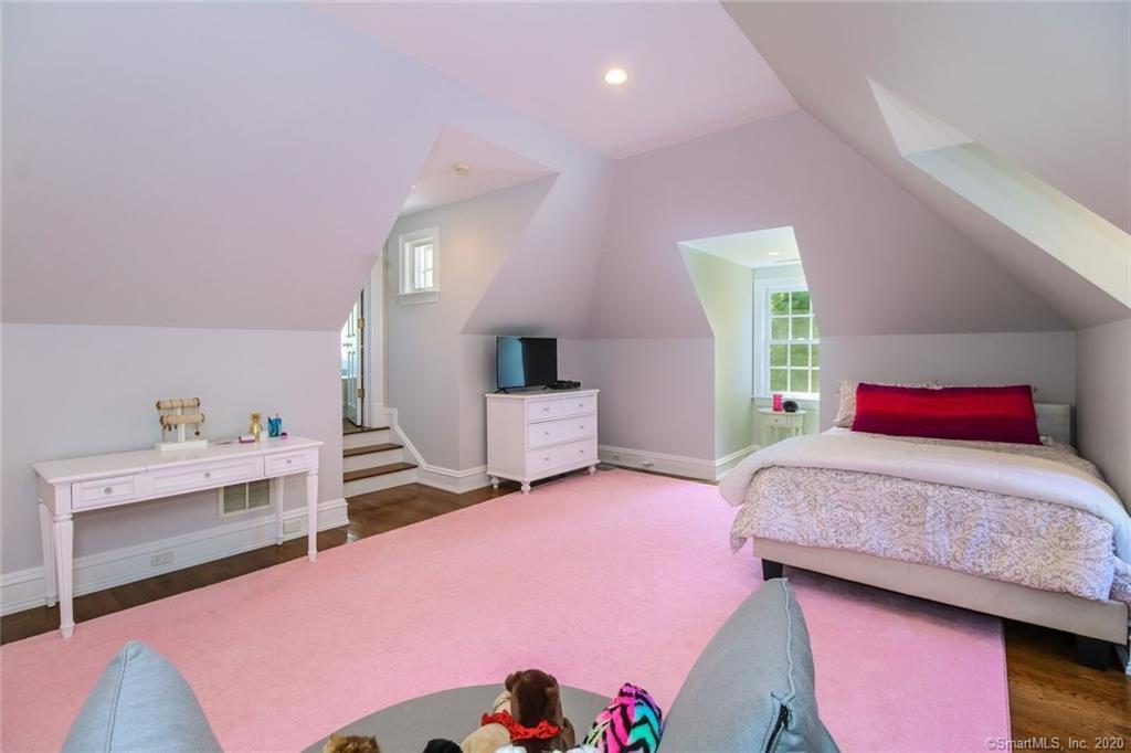 83 Lukes Wood Road New Canaan, CT 06840 - Photo 22 of 51 a bedroom with a bed and a dresser