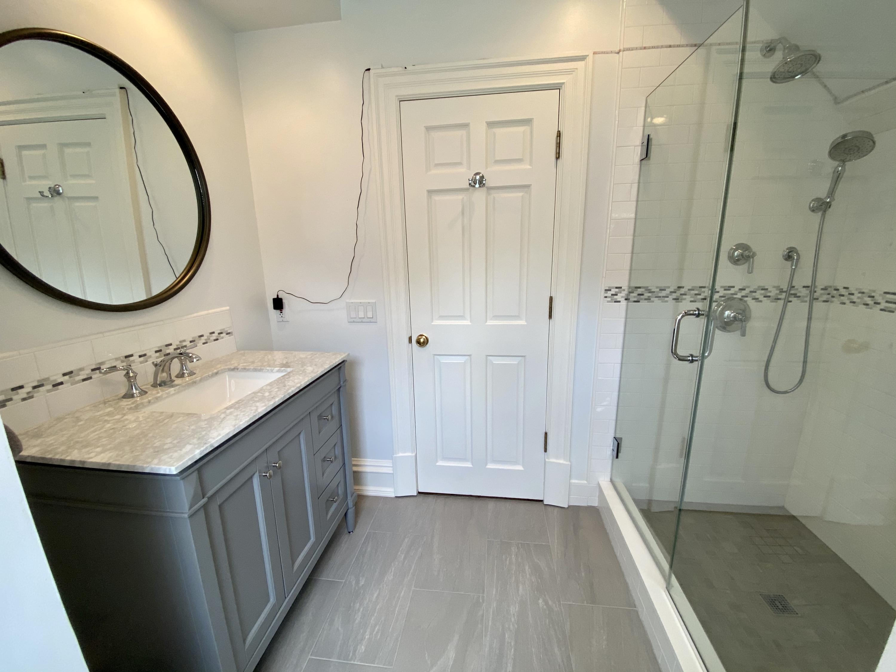 83 Lukes Wood Road New Canaan, CT 06840 - Photo 24 of 51 a bathroom with a sink a toilet and shower