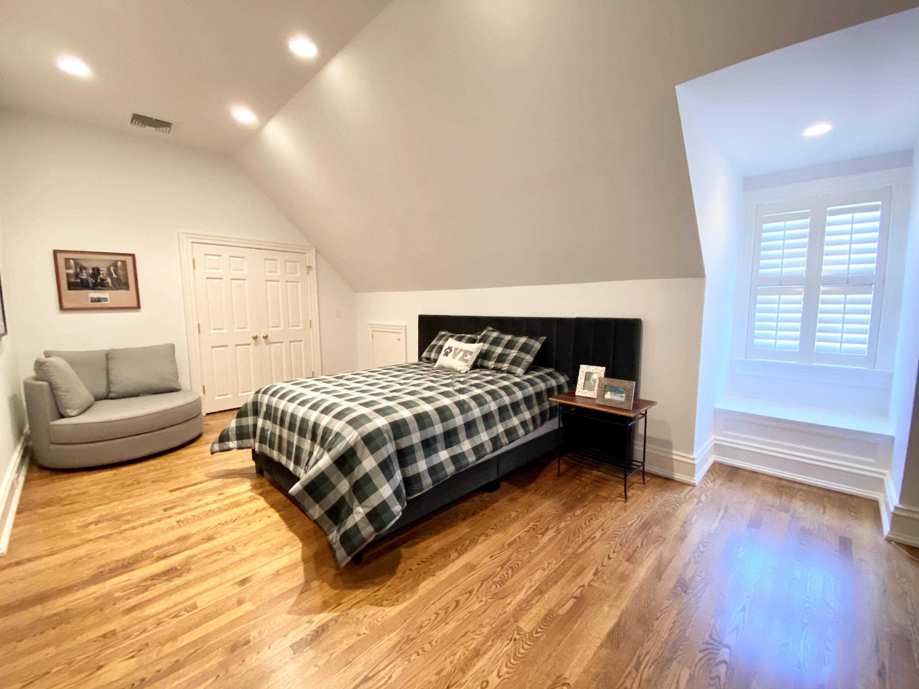 83 Lukes Wood Road New Canaan, CT 06840 - Photo 28 of 51 a bedroom with a bed and a couch