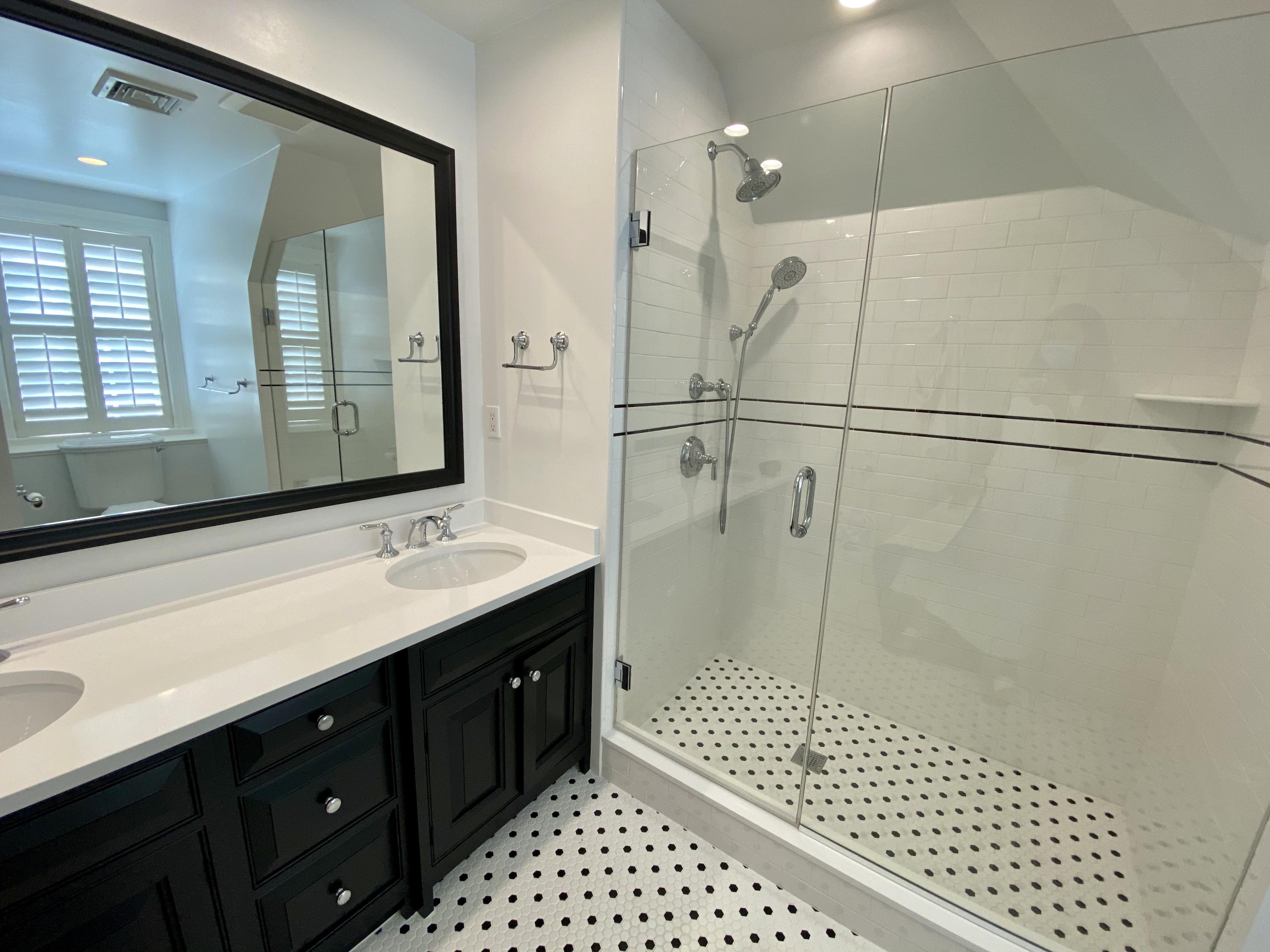 83 Lukes Wood Road New Canaan, CT 06840 - Photo 29 of 51 a bathroom with a double vanity sink mirror and shower