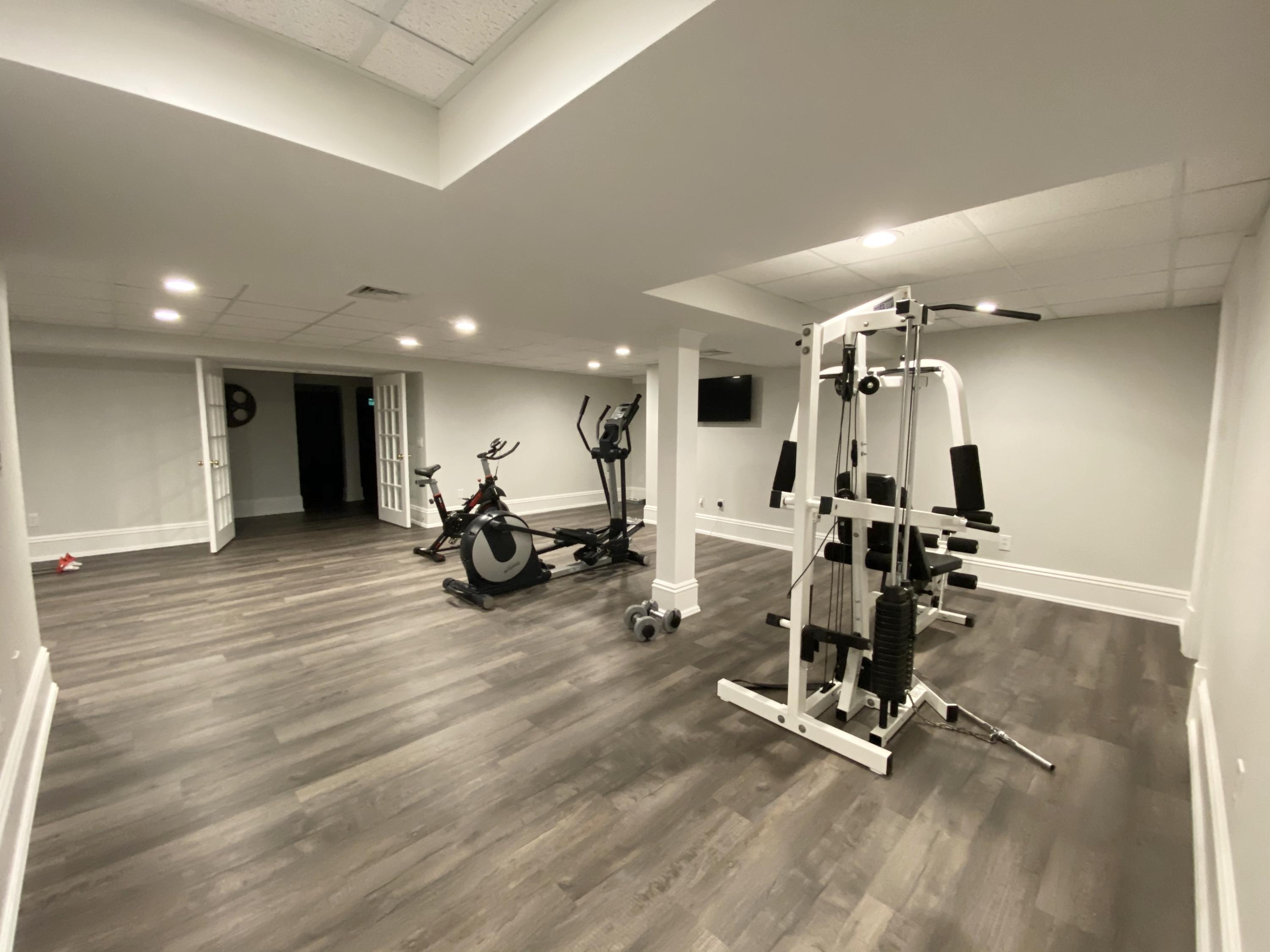 83 Lukes Wood Road New Canaan, CT 06840 - Photo 31 of 51 a view of a room with gym equipment