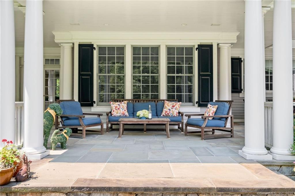 83 Lukes Wood Road New Canaan, CT 06840 - Photo 34 of 51 a view of a patio with couple of couch and chairs