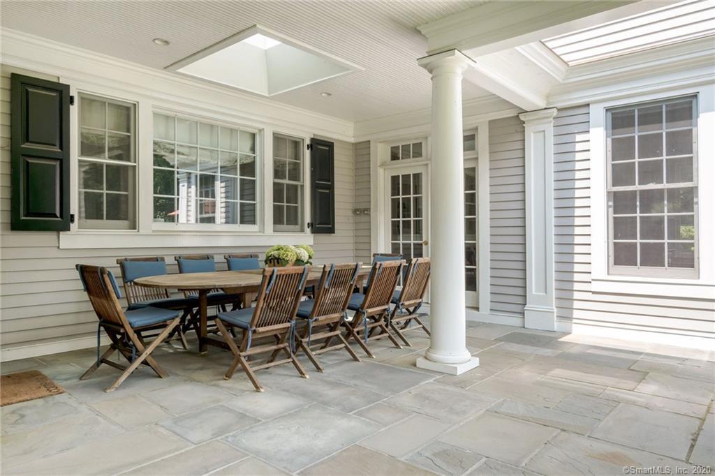 83 Lukes Wood Road New Canaan, CT 06840 - Photo 37 of 51 a view of a dining room with furniture and windows