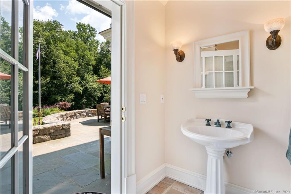 83 Lukes Wood Road New Canaan, CT 06840 - Photo 38 of 51 a view of a bathroom sink and a bath tub