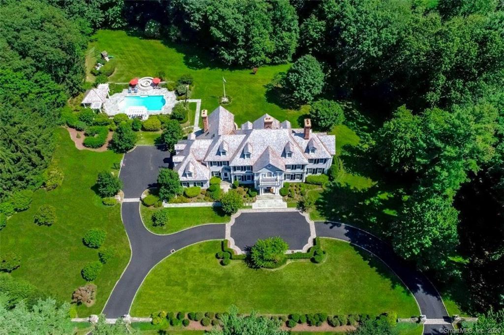 83 Lukes Wood Road New Canaan, CT 06840 - Photo 50 of 51 a view of a garden with plants and large trees