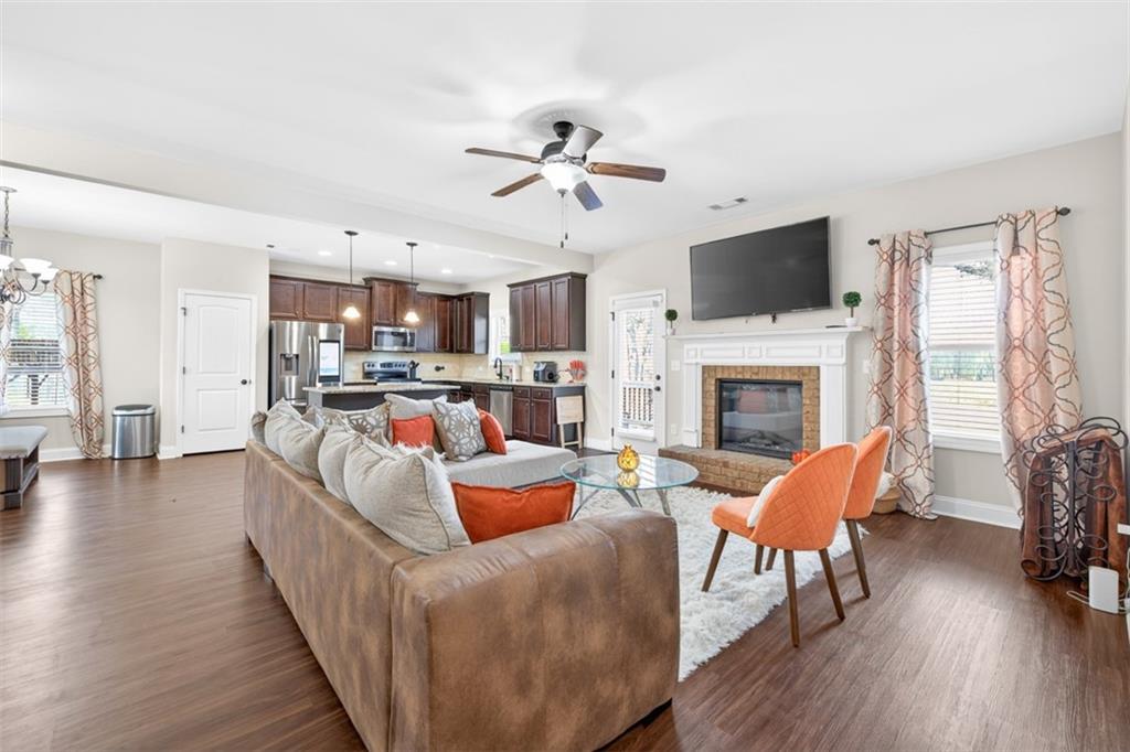 860 Tranquil Way Hampton, GA 30228 - Photo 11 of 54 a living room with furniture fireplace and a flat screen tv