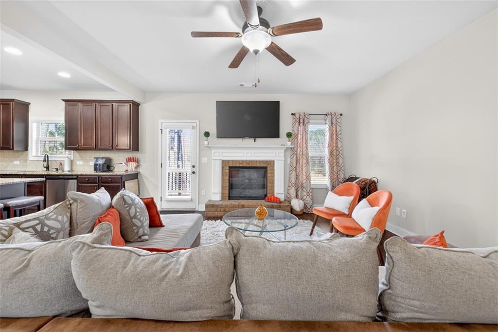860 Tranquil Way Hampton, GA 30228 - Photo 12 of 54 a living room with furniture fireplace and a flat screen tv