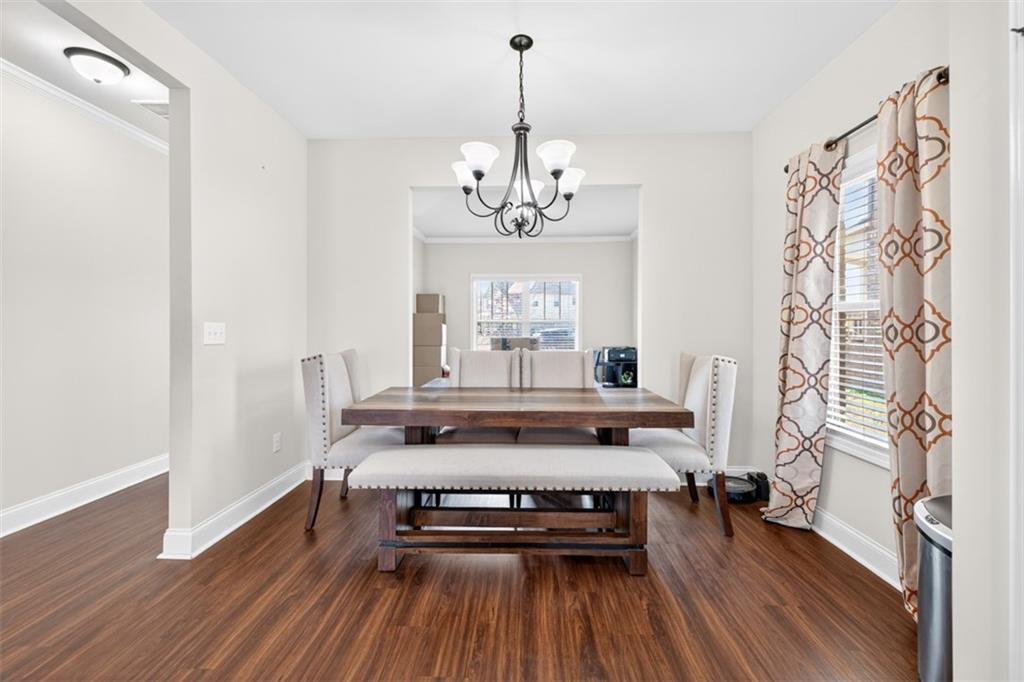 860 Tranquil Way Hampton, GA 30228 - Photo 20 of 54 a view of a room with furniture wooden floor and window