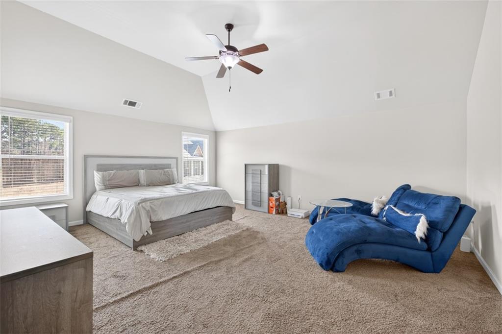 860 Tranquil Way Hampton, GA 30228 - Photo 25 of 54 a spacious bedroom with a bed and window