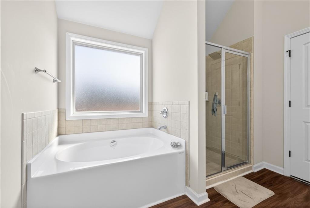 860 Tranquil Way Hampton, GA 30228 - Photo 30 of 54 a white bath tub sitting next to a shower