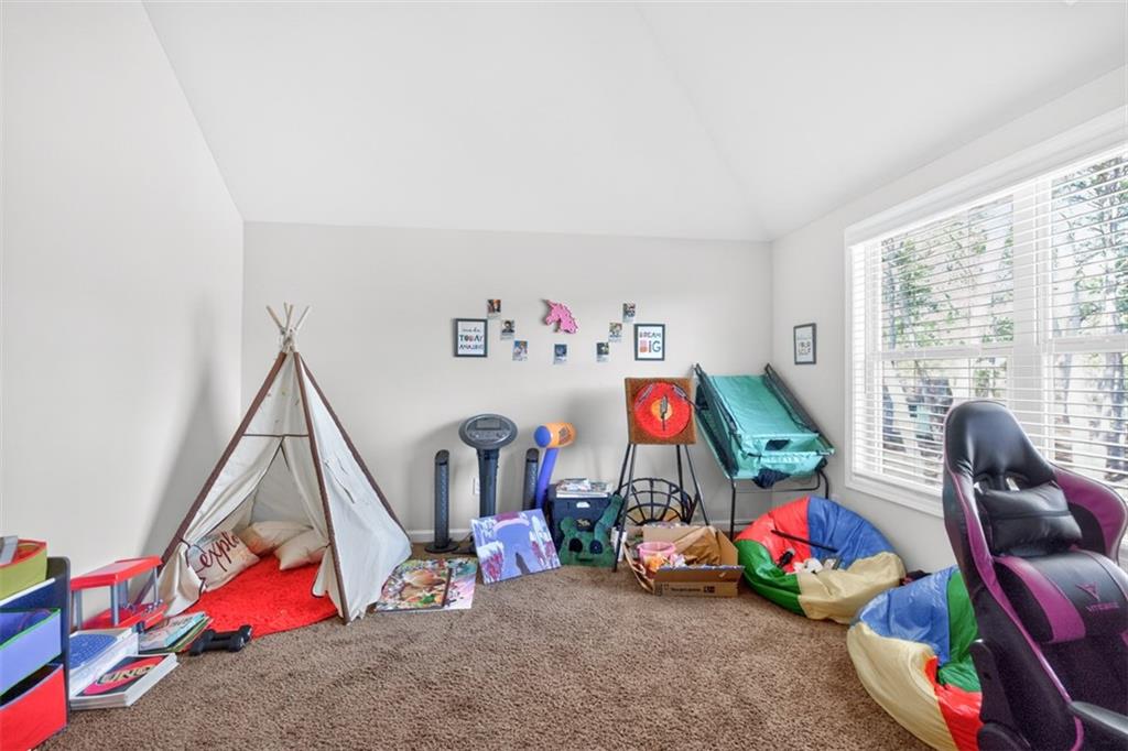 860 Tranquil Way Hampton, GA 30228 - Photo 33 of 54 a children room with toys and a fan