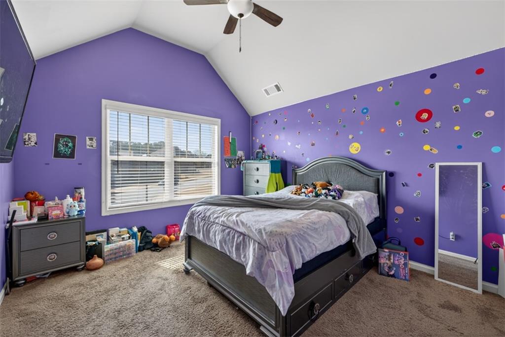 860 Tranquil Way Hampton, GA 30228 - Photo 35 of 54 a bedroom with a bed and a window