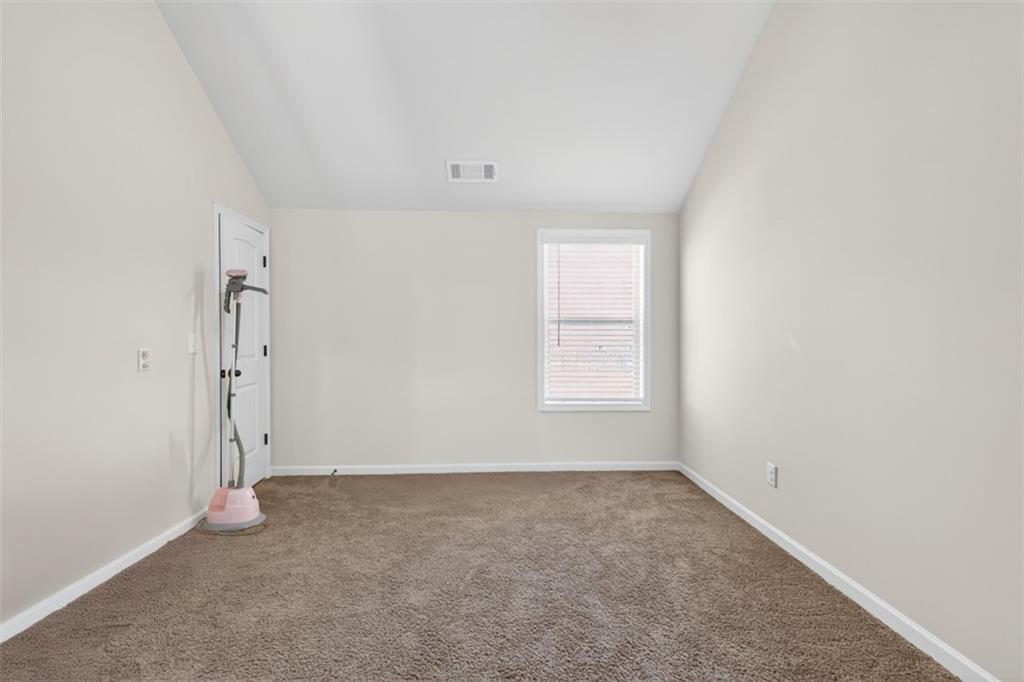 860 Tranquil Way Hampton, GA 30228 - Photo 38 of 54 an empty room with window