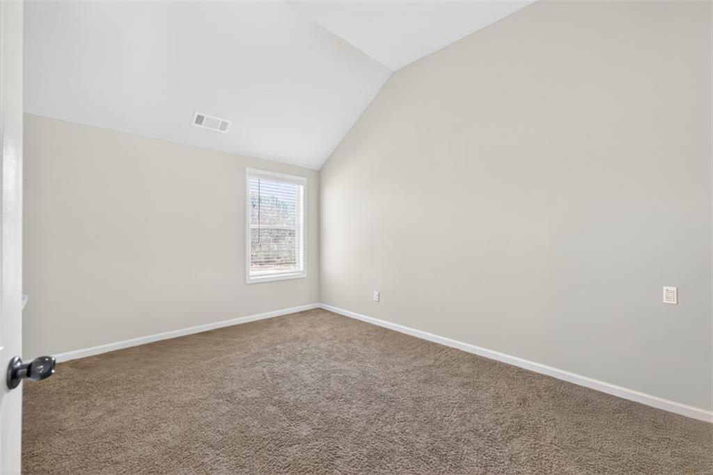 860 Tranquil Way Hampton, GA 30228 - Photo 39 of 54 an empty room with a window