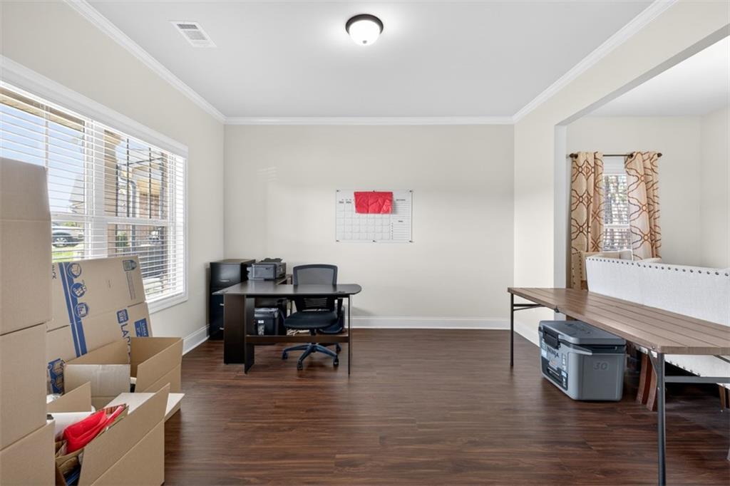 860 Tranquil Way Hampton, GA 30228 - Photo 4 of 54 a living room with furniture and a large window