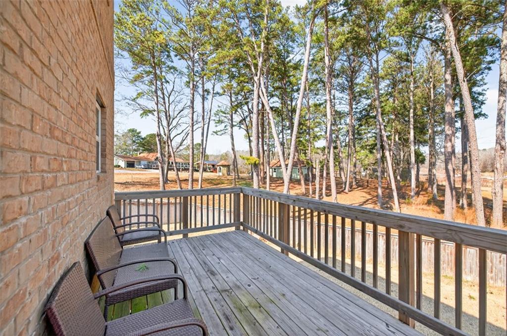 860 Tranquil Way Hampton, GA 30228 - Photo 46 of 54 a view of a wooden chairs in balcony