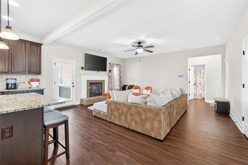 860 Tranquil Way Hampton, GA 30228 - Photo 7 of 54 a living room with fireplace furniture and a flat screen tv