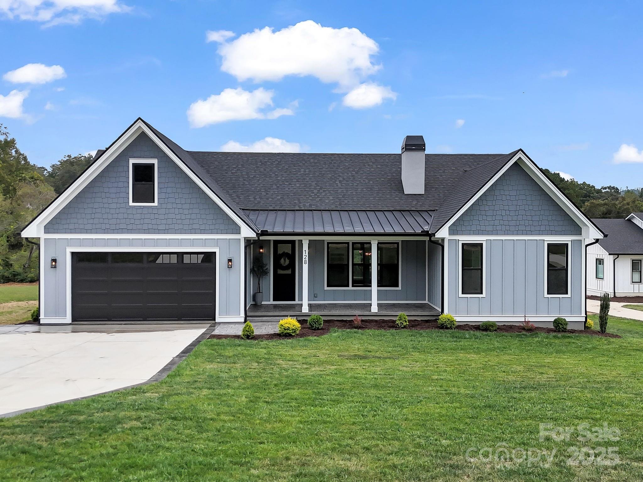 128 Gravely Branch Road Fletcher, NC 28732 - Photo 1 of 48 a front view of house with a garden