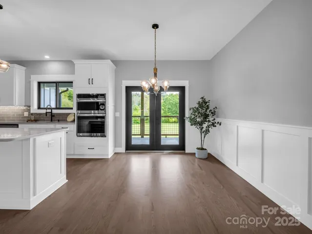 a view of a kitchen with stove and cabinets