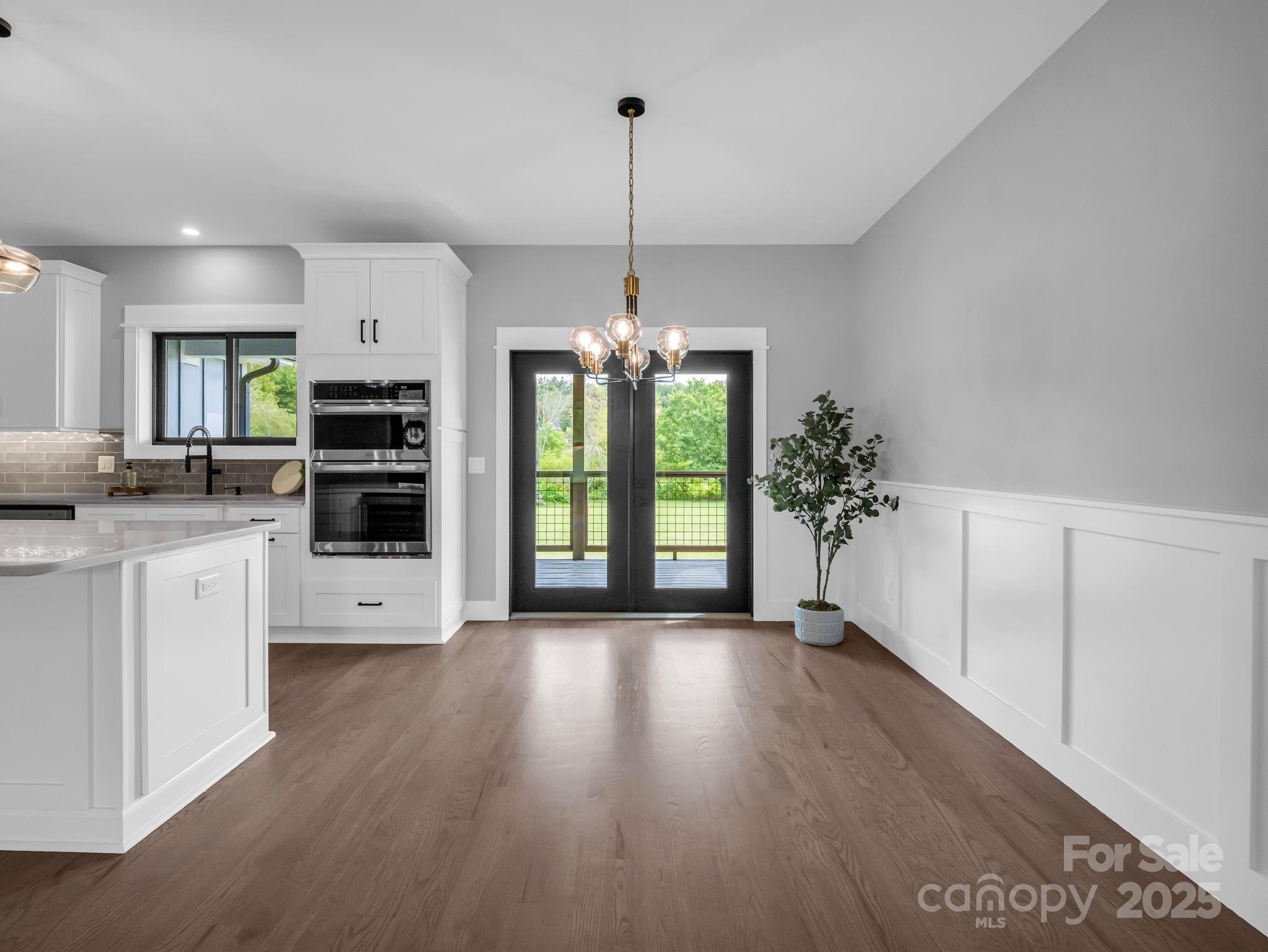 128 Gravely Branch Road Fletcher, NC 28732 - Photo 11 of 48 a view of a kitchen with stove and cabinets