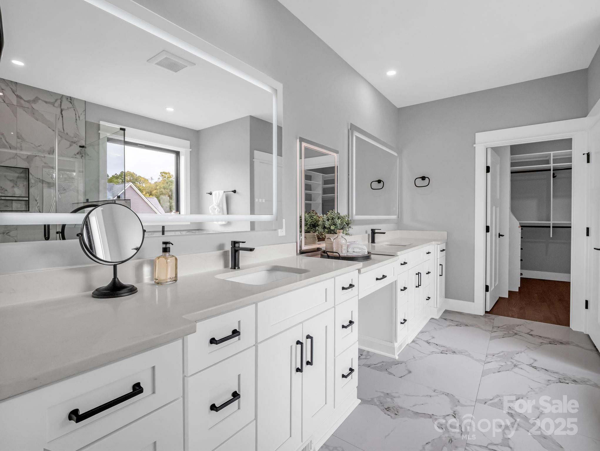 128 Gravely Branch Road Fletcher, NC 28732 - Photo 20 of 48 a spacious bathroom with a double vanity sink mirror and a shower
