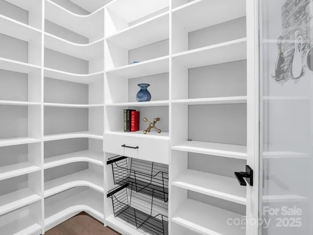 a room with a gym equipment and a shower