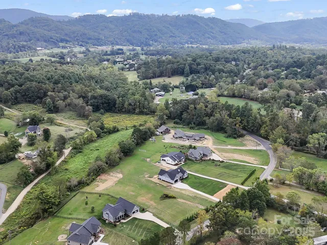 an aerial view of a lush green valley