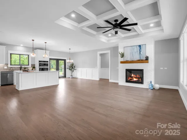 an empty room with furniture and a fireplace