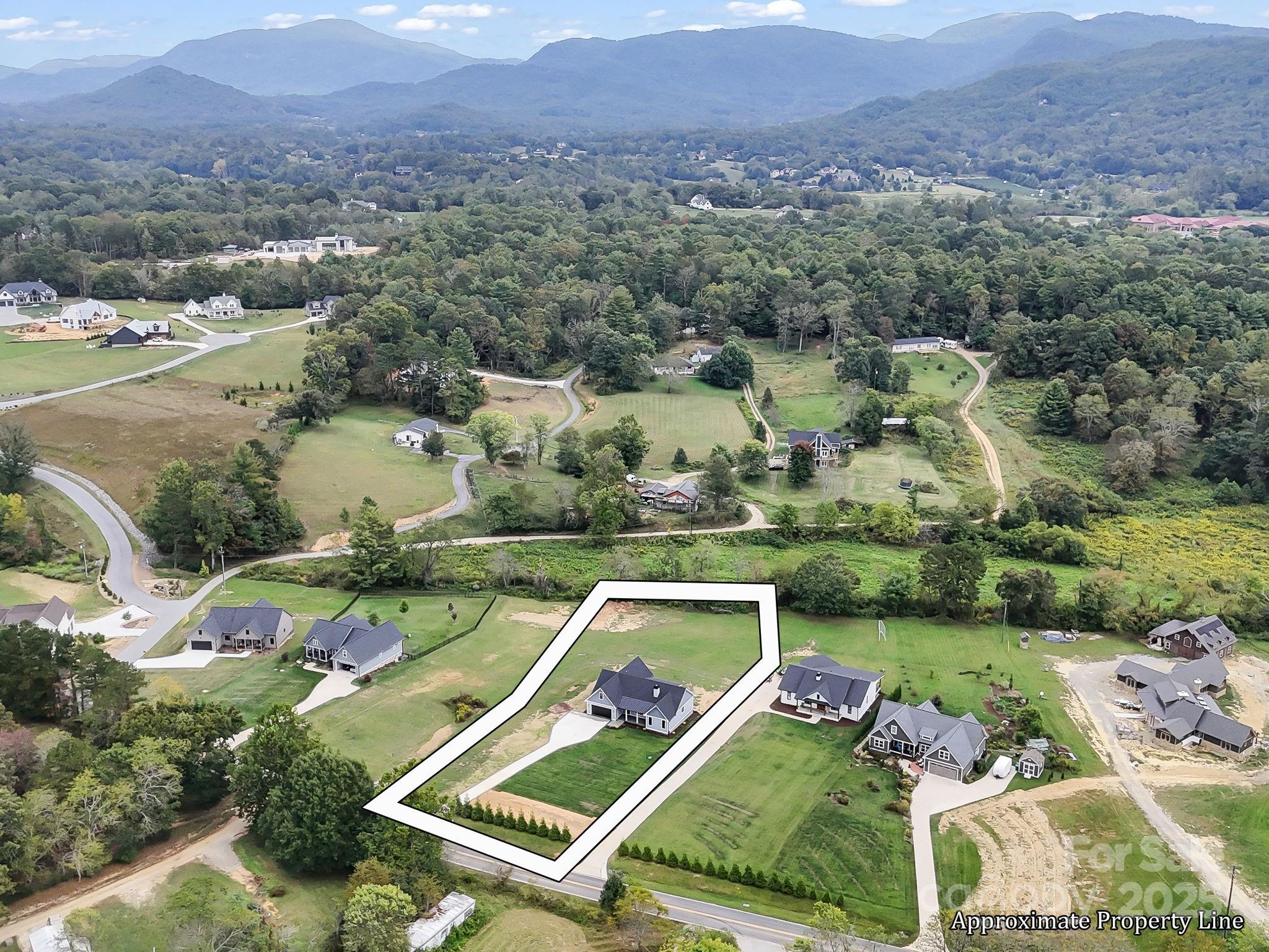 128 Gravely Branch Road Fletcher, NC 28732 - Photo 46 of 48 an aerial view of a house with a garden